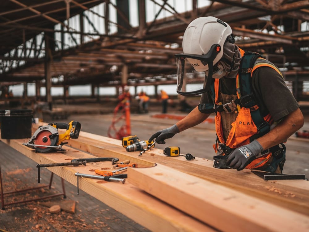 Builder at a workbench with power tools